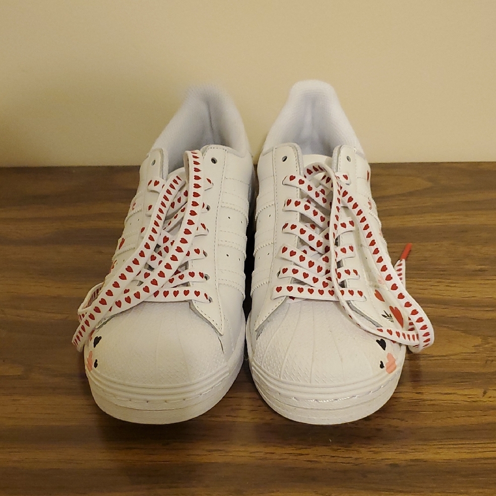 White Adidas Superstar Sneakers with Heart Pattern Laces